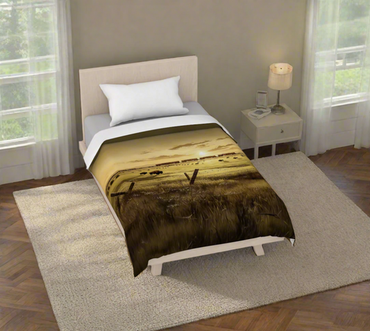 Bed with a landscape-themed duvet cover on a white background
