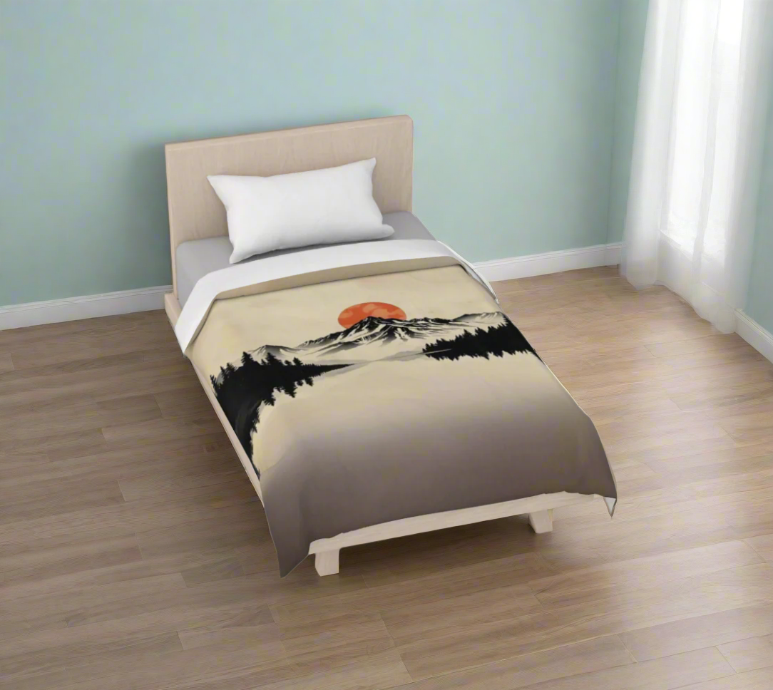 Bed with a duvet featuring a sunset over mountains design on a white background